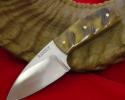 Small hunting knife with hollow ground-three finger with rams horn handle.