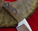 Short palm knife with a handle made from stag elk horn is easy to use and carry.